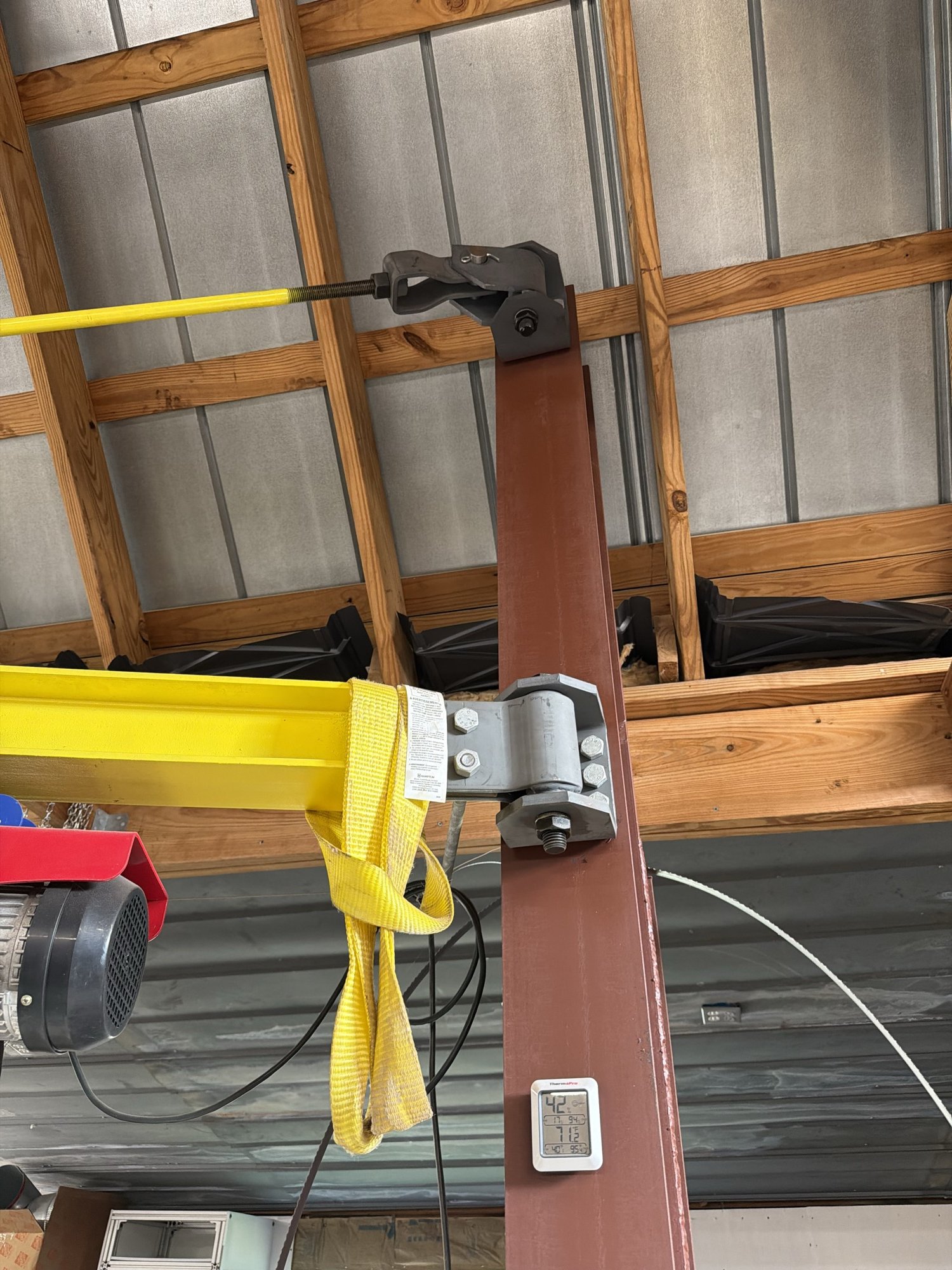 Close-up of the jib arm's hinge on the steel post